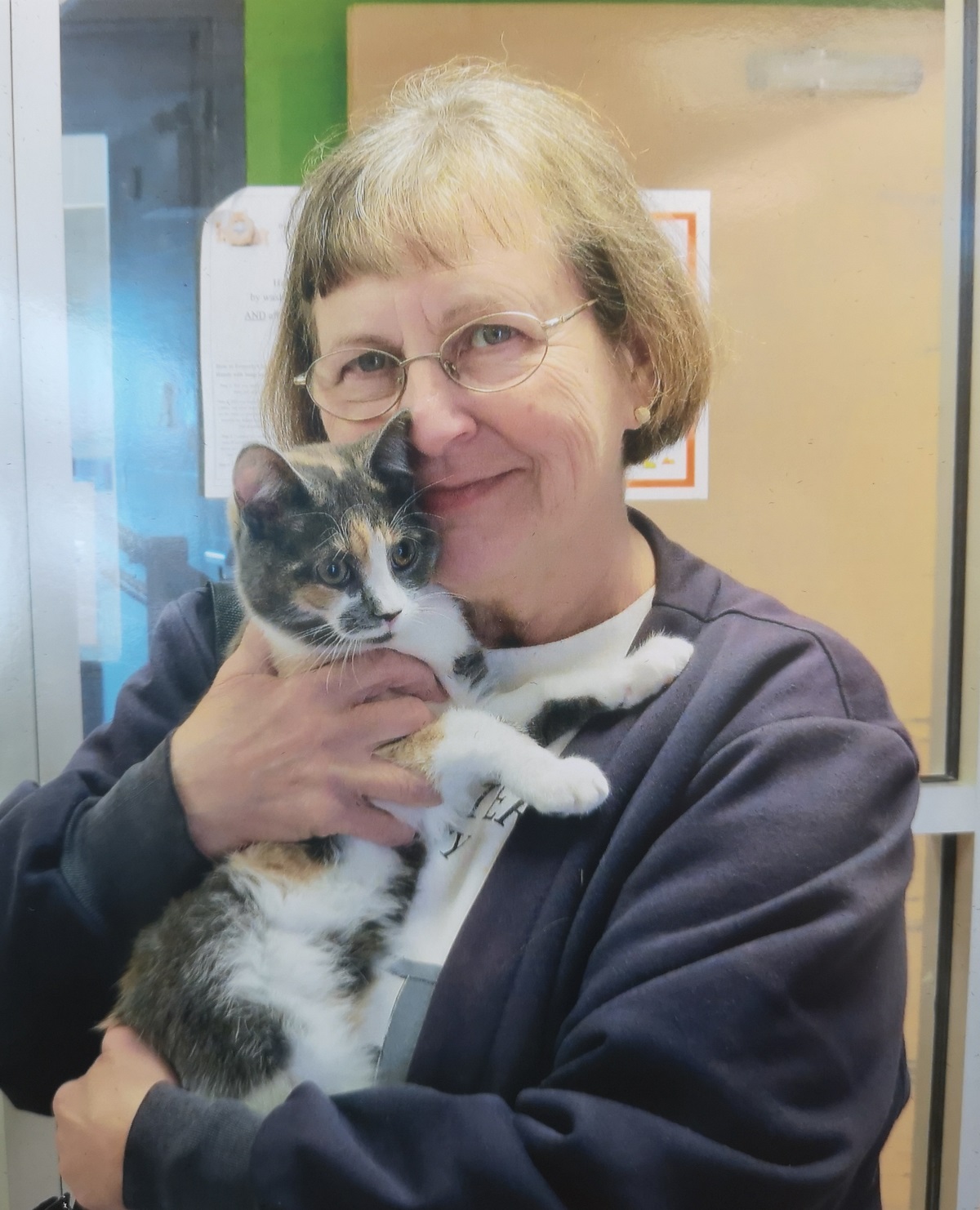 Cyndy Richards holding adopted kitten