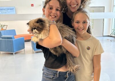 Mom and daughters adopt large fluffy cat