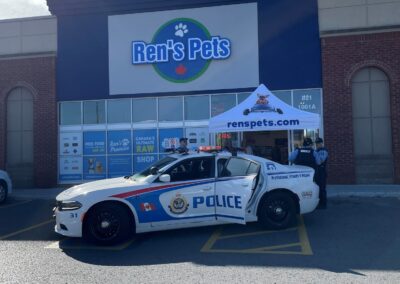 Peterborough Police Service car in front of Rens Pets for donation event
