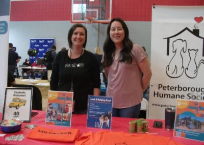 Two women at Peterborough Humane Society booth at Volunteer Showcase