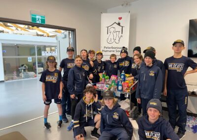 Boys hockey team with donation of animal goods
